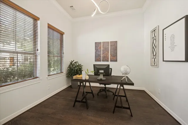 a living room with furniture kitchen view and a chandelier