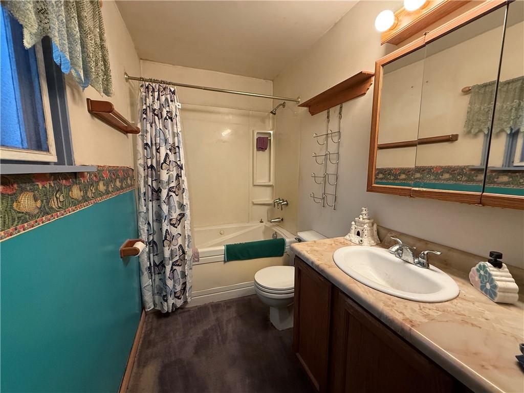 727 Thompson Street Turtle Creek, PA 15145 - Photo 13 of 25 a bathroom with a granite countertop sink toilet and shower