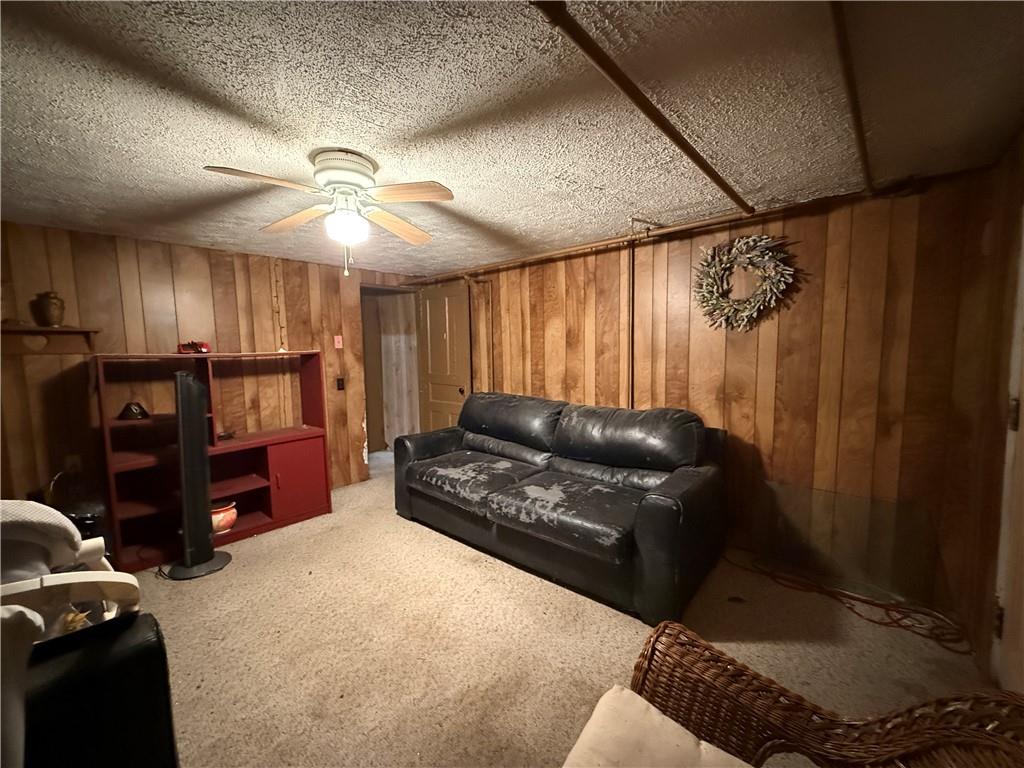 727 Thompson Street Turtle Creek, PA 15145 - Photo 15 of 25 a living room with furniture and a flat screen tv