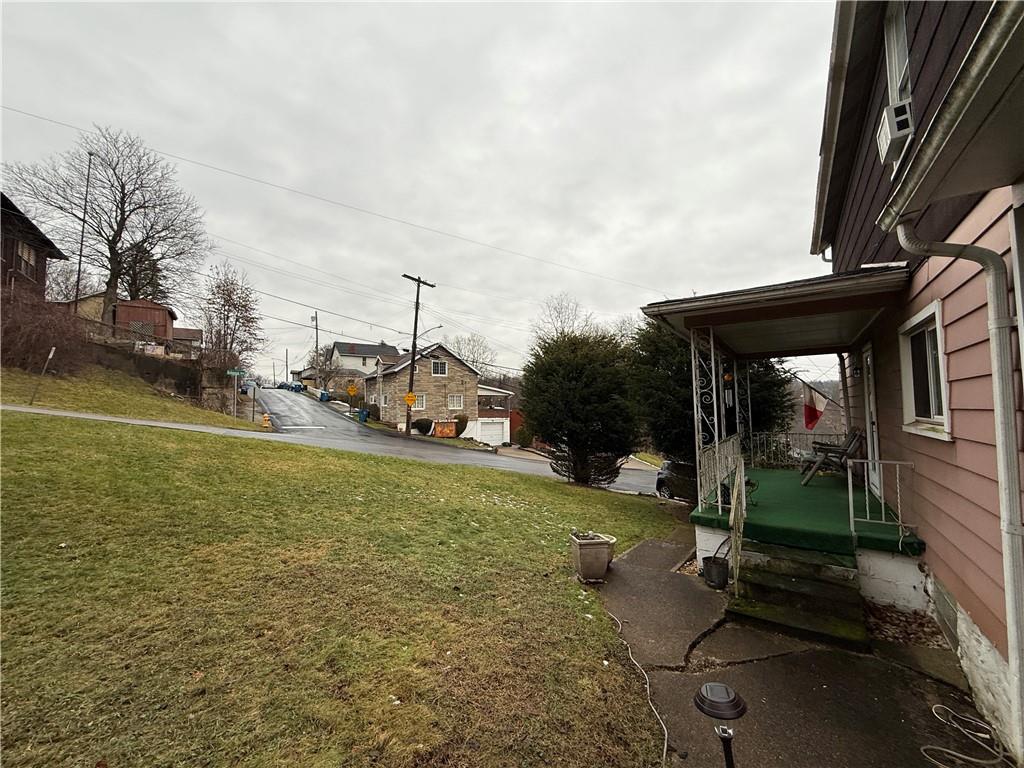727 Thompson Street Turtle Creek, PA 15145 - Photo 24 of 25 a view of a patio with table and chairs a barbeque with wooden fence