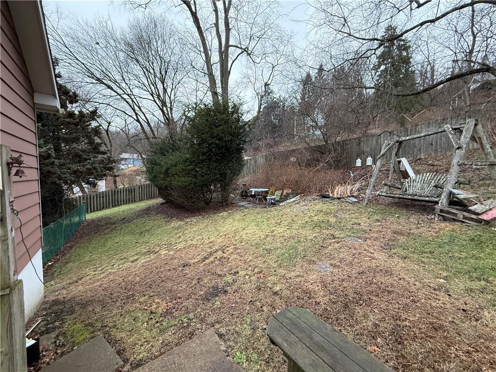 727 Thompson Street Turtle Creek, PA 15145 - Photo 25 of 25 a view of backyard with parked car