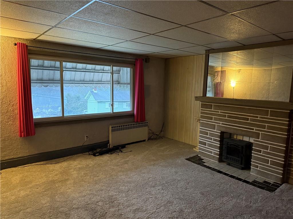 727 Thompson Street Turtle Creek, PA 15145 - Photo 4 of 25 a room with a fireplace and a window
