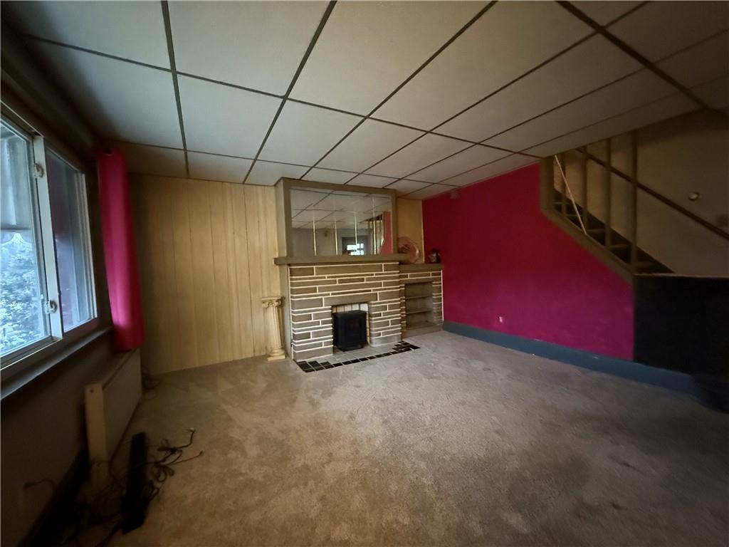 727 Thompson Street Turtle Creek, PA 15145 - Photo 5 of 25 a view of an empty room with a fireplace