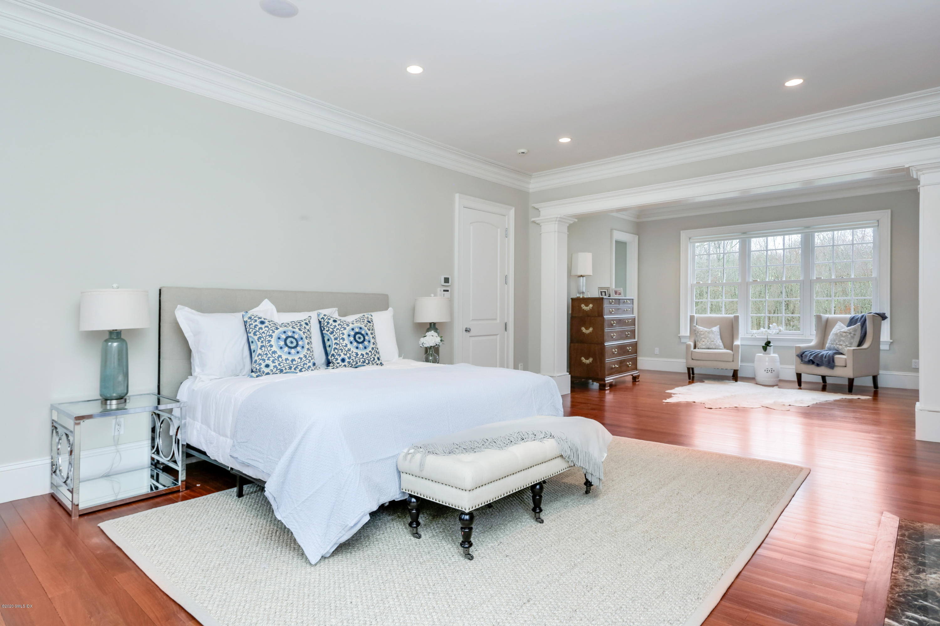 70 Old Mill Road Greenwich, CT 06831 - Photo 12 of 20 a spacious bedroom with a bed and wooden floor