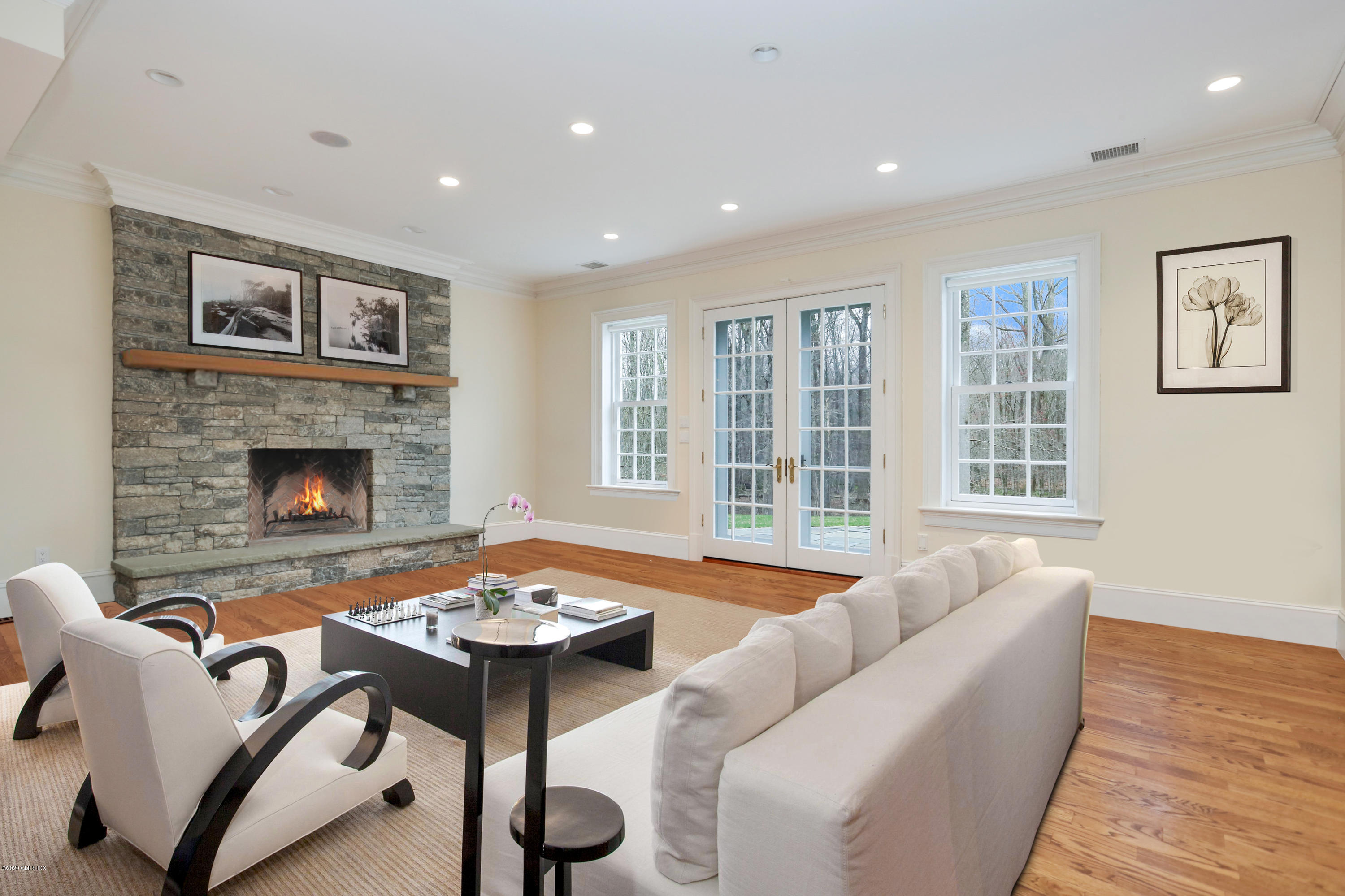 70 Old Mill Road Greenwich, CT 06831 - Photo 13 of 20 a living room with furniture and a fireplace