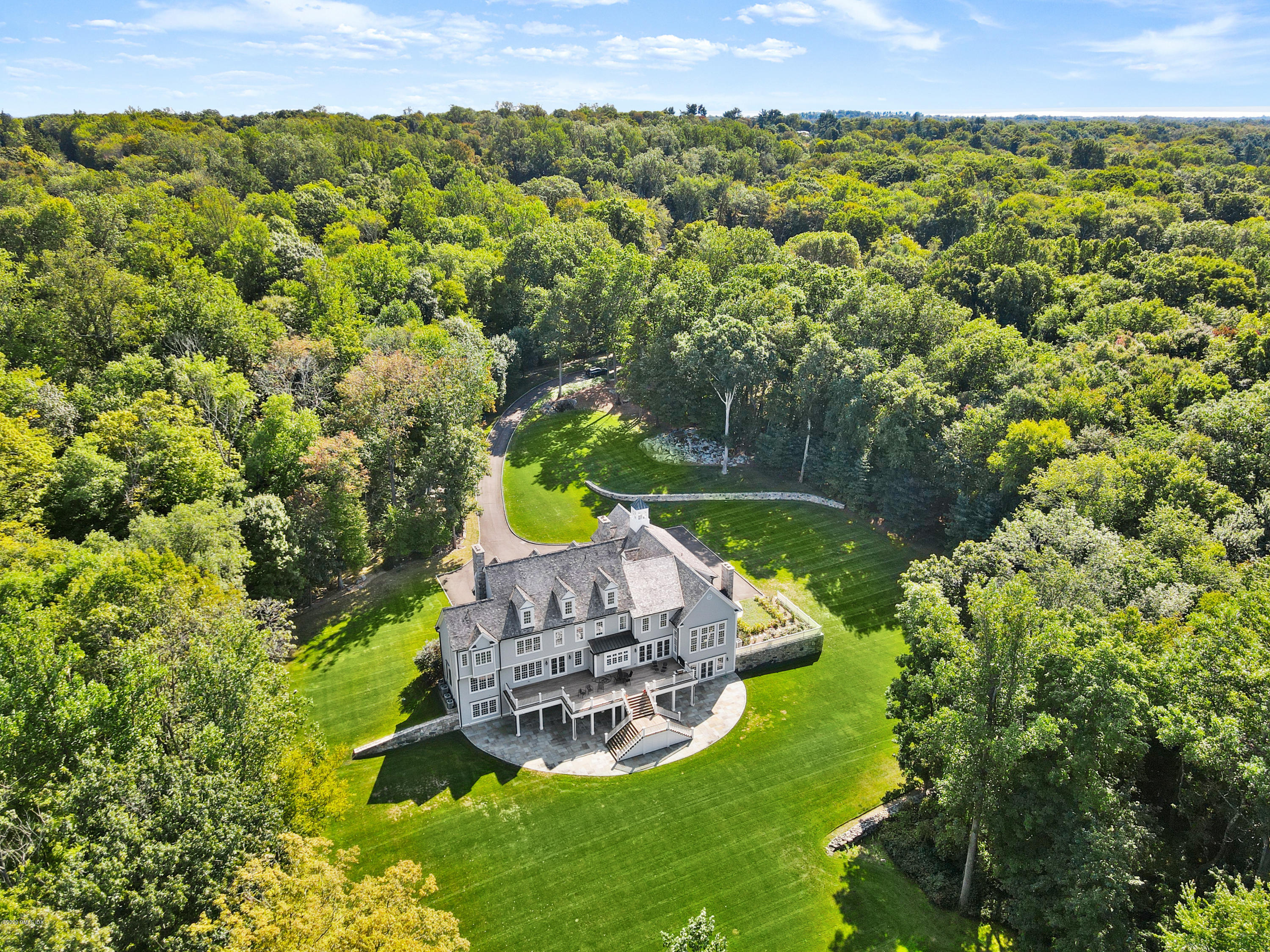 70 Old Mill Road Greenwich, CT 06831 - Photo 16 of 20 a view of a wooden house with a yard