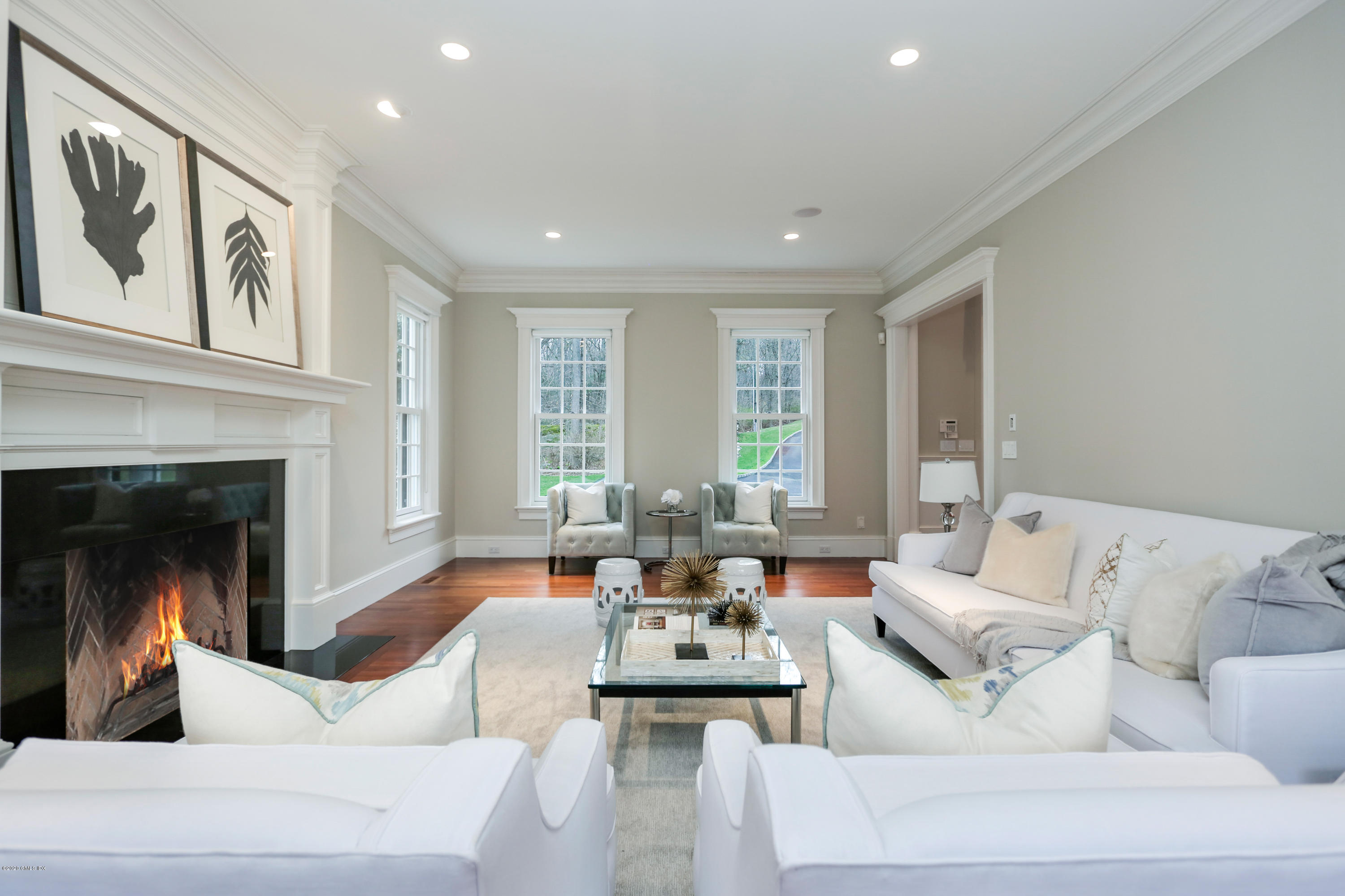 70 Old Mill Road Greenwich, CT 06831 - Photo 5 of 20 a living room with couches and a fireplace