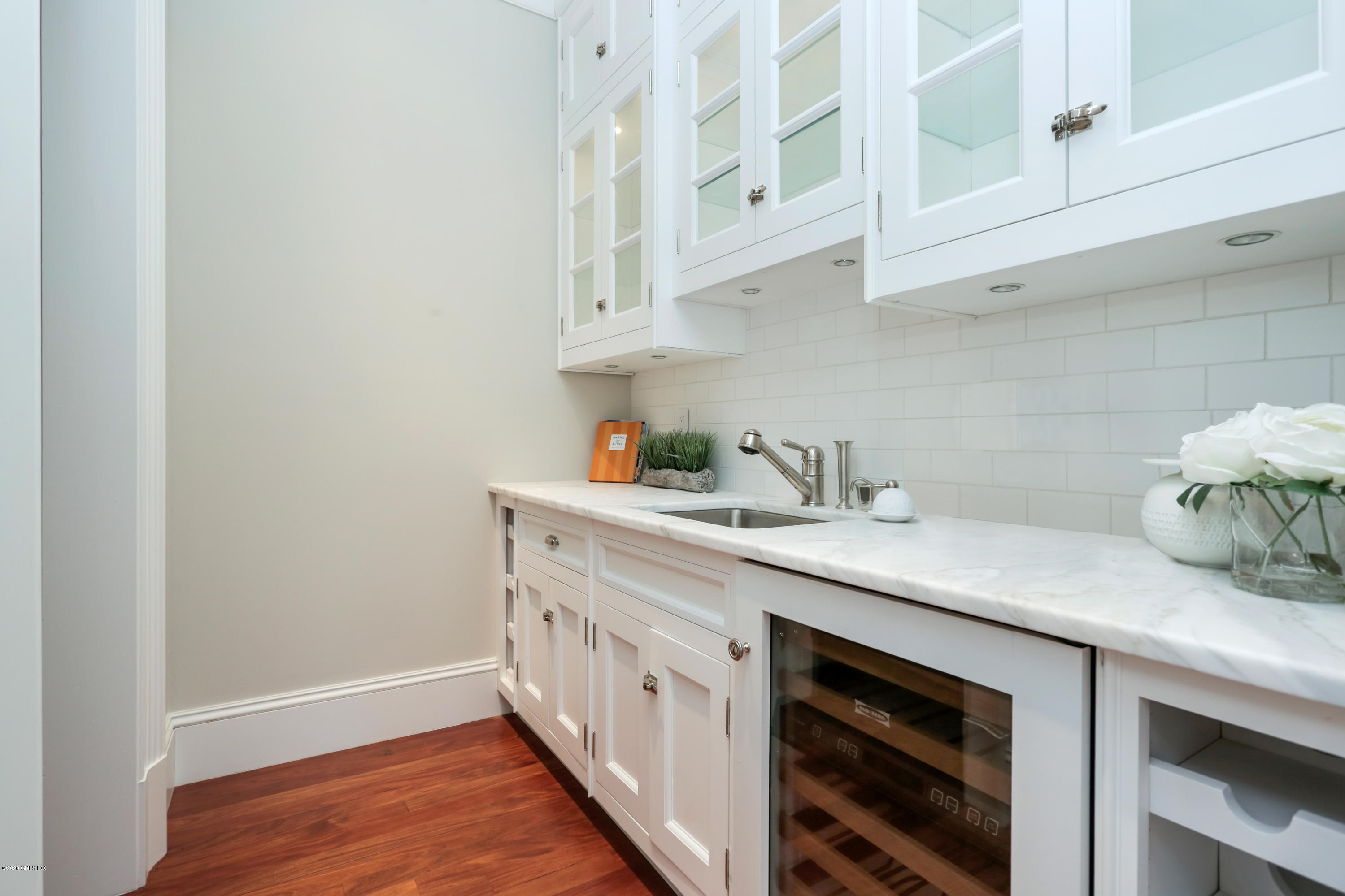 70 Old Mill Road Greenwich, CT 06831 - Photo 10 of 20 a kitchen with stainless steel appliances white cabinets and a sink