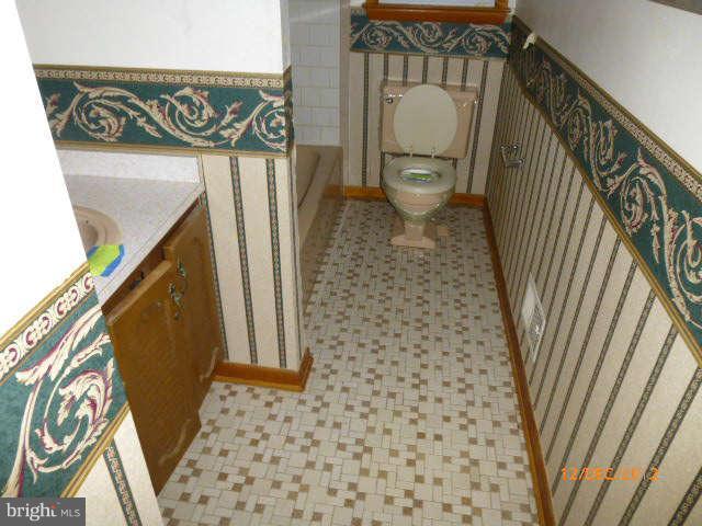 3945 Salem Bottom Road Westminster, MD 21157 - Photo 5 of 11 a bathroom with a toilet a sink and a shower