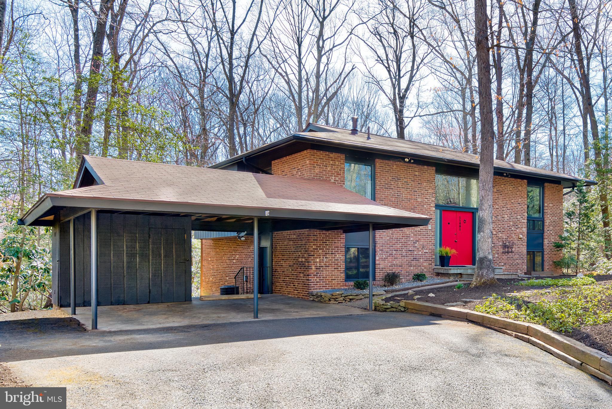 11401 Drop Forge Lane Reston, VA 20191 - Photo 2 of 38 a front view of a house with a yard and garage