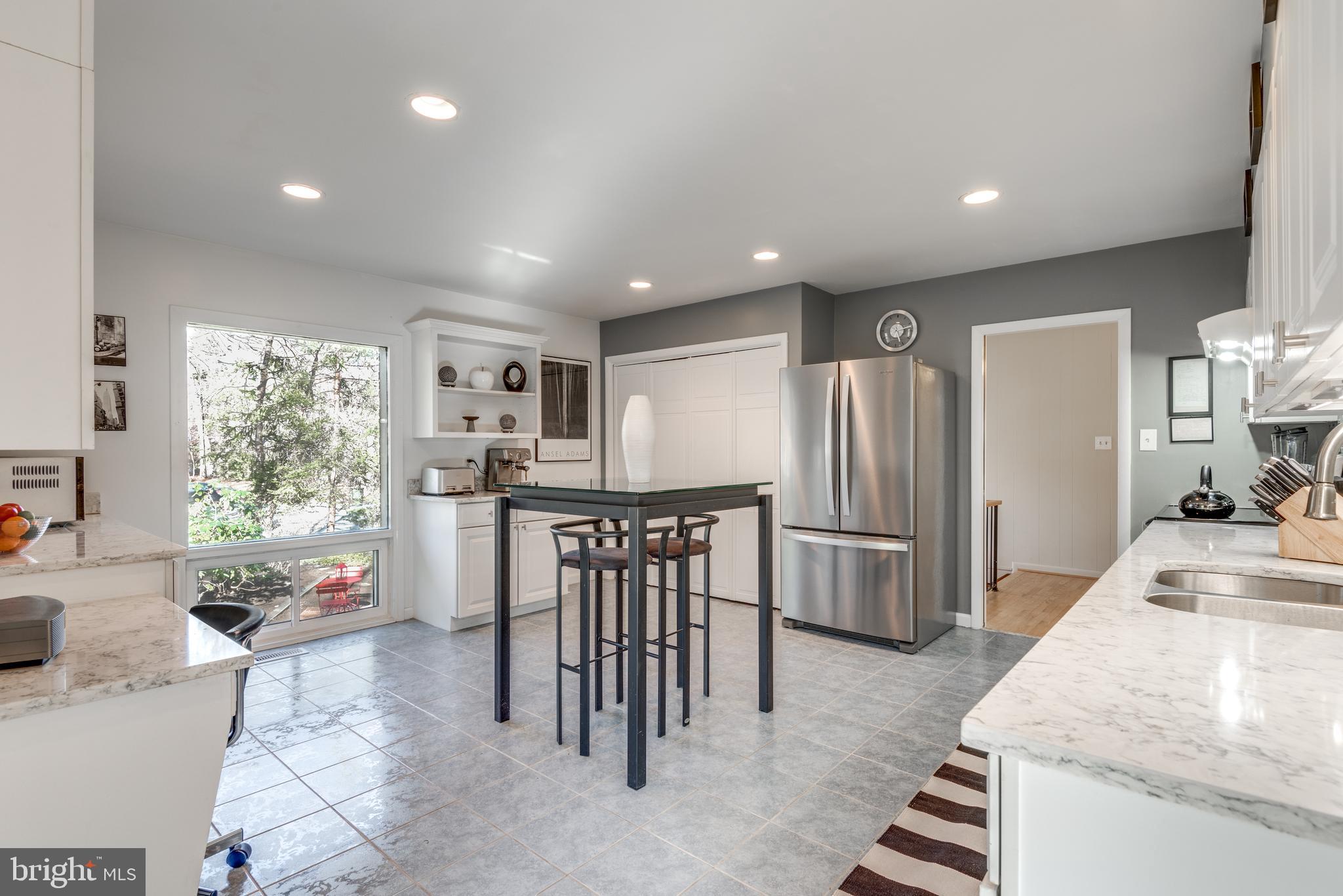 11401 Drop Forge Lane Reston, VA 20191 - Photo 12 of 38 a kitchen with stainless steel appliances granite countertop a refrigerator sink and stove