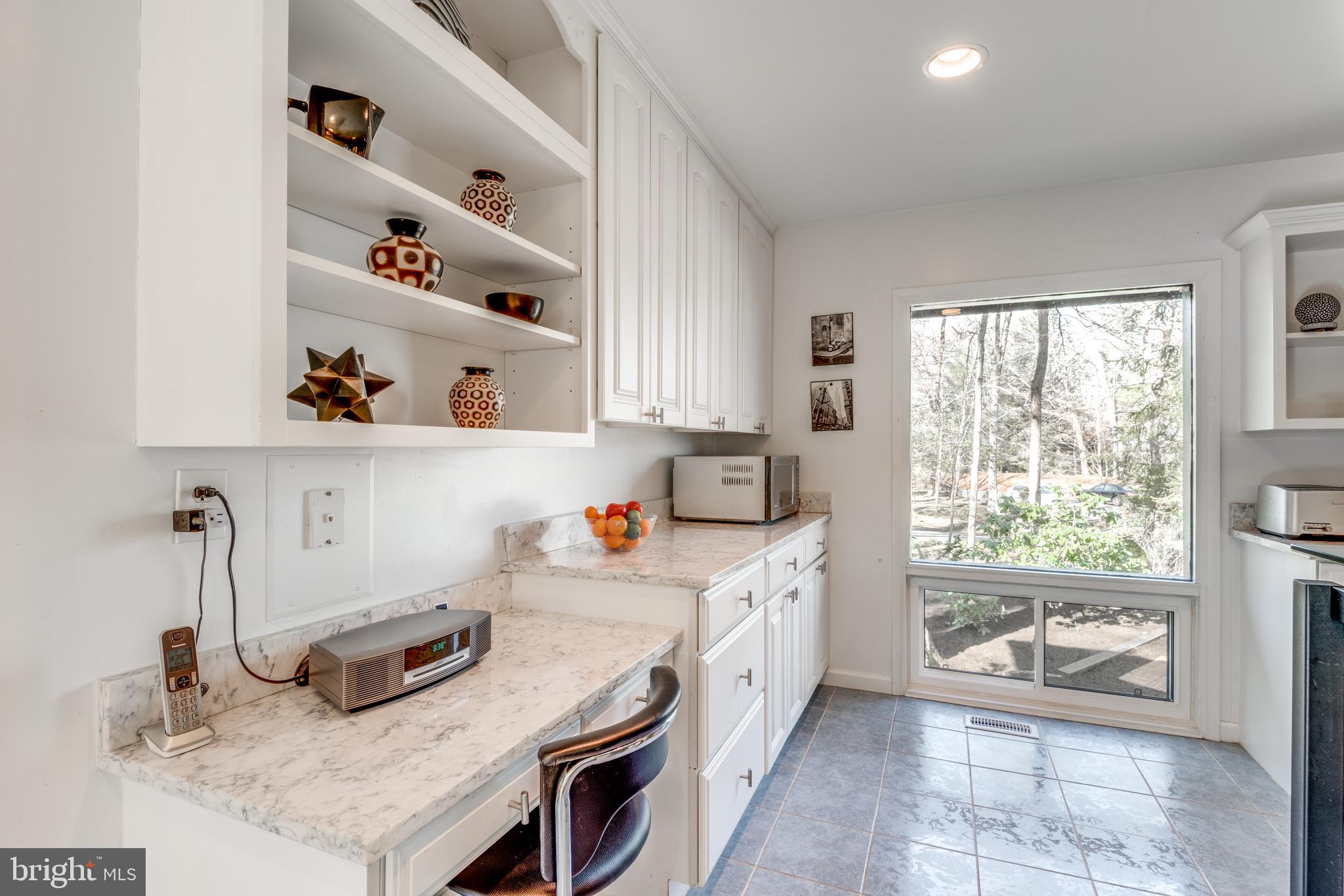 11401 Drop Forge Lane Reston, VA 20191 - Photo 17 of 38 a kitchen with granite countertop a sink and a stove