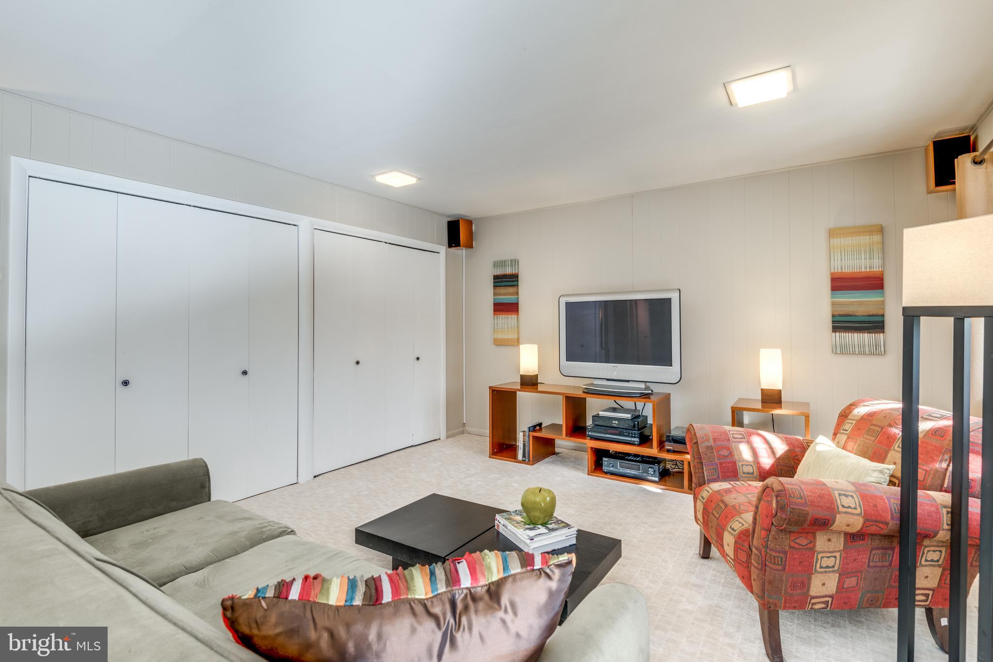 11401 Drop Forge Lane Reston, VA 20191 - Photo 20 of 38 a living room with furniture and a flat screen tv