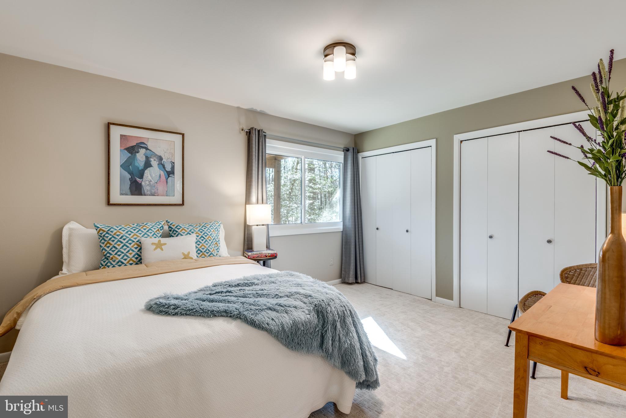 11401 Drop Forge Lane Reston, VA 20191 - Photo 22 of 38 a bedroom with a large bed and a window