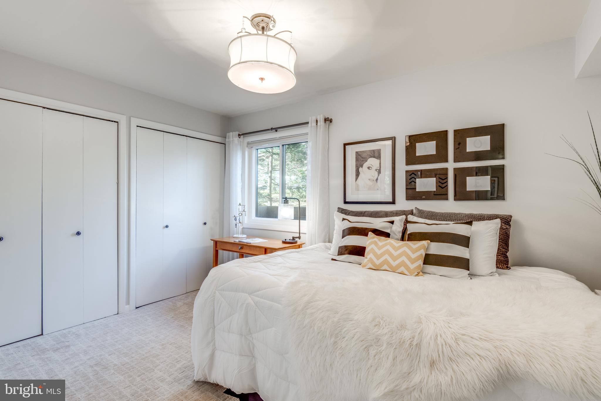 11401 Drop Forge Lane Reston, VA 20191 - Photo 23 of 38 a bedroom with a bed and window