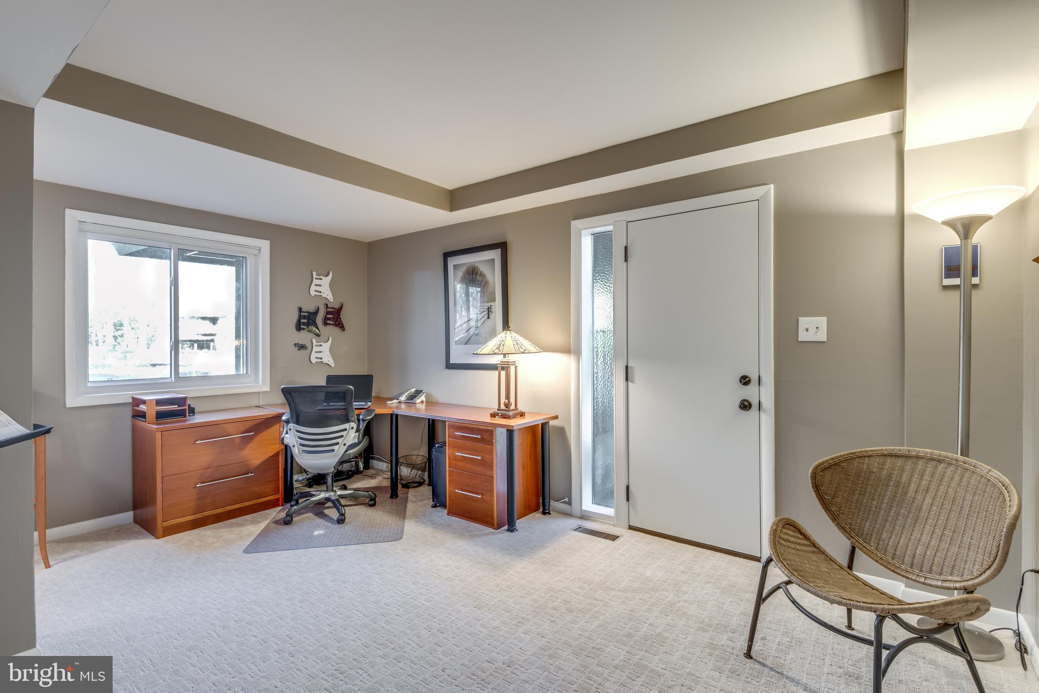 11401 Drop Forge Lane Reston, VA 20191 - Photo 24 of 38 a living room with furniture a piano and a window