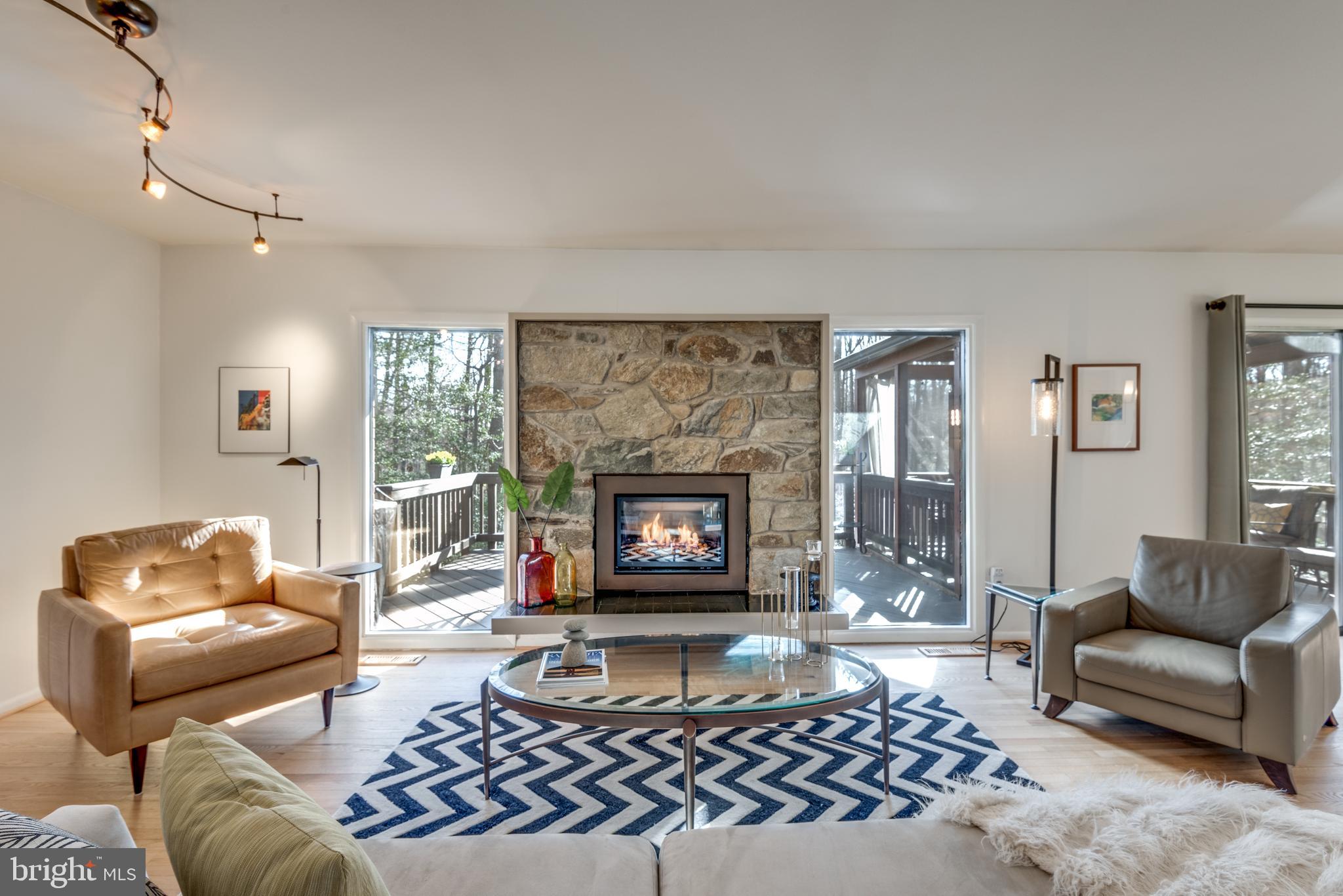11401 Drop Forge Lane Reston, VA 20191 - Photo 4 of 38 a living room with furniture a rug and a fireplace