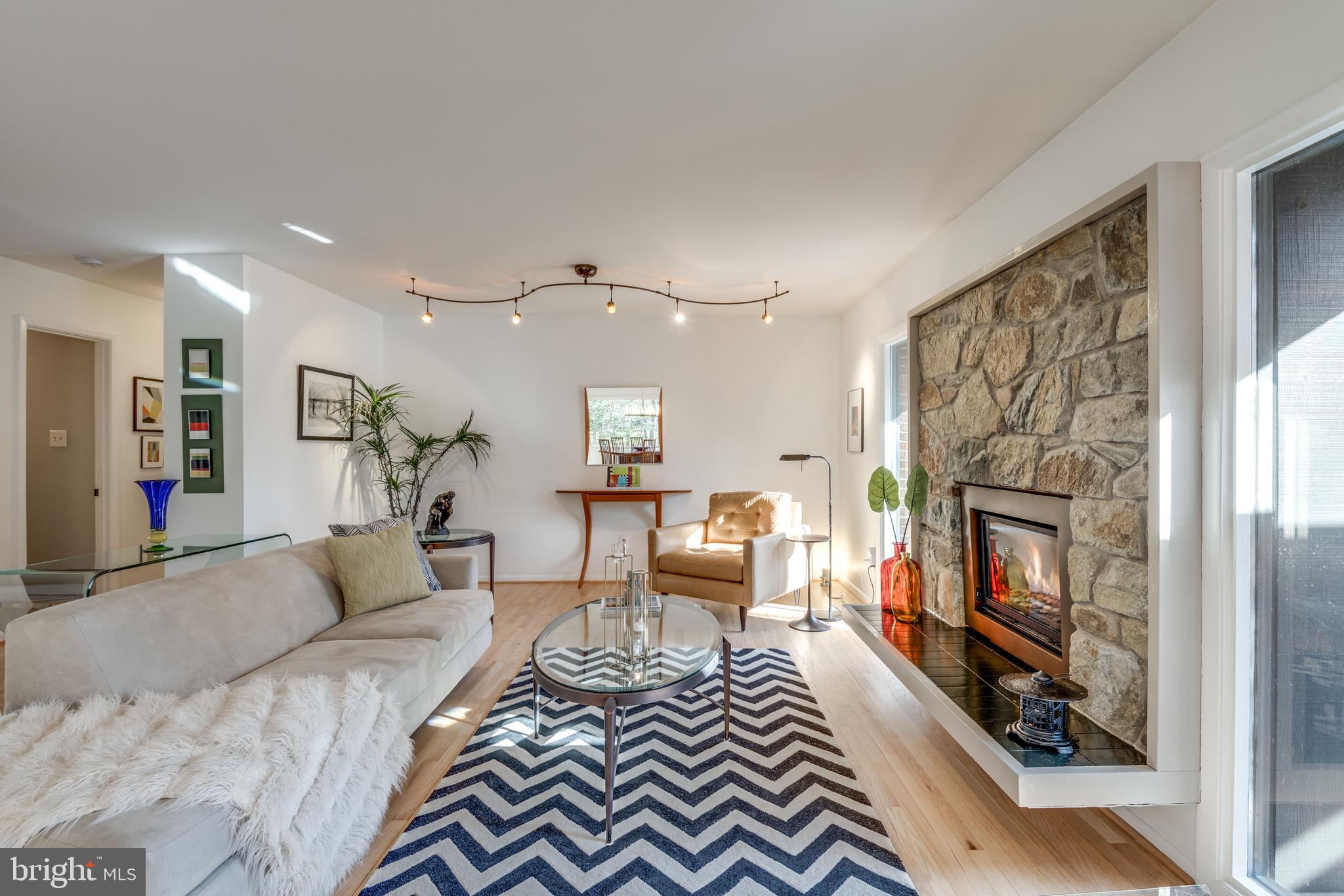 11401 Drop Forge Lane Reston, VA 20191 - Photo 6 of 38 a living room with furniture and a fireplace