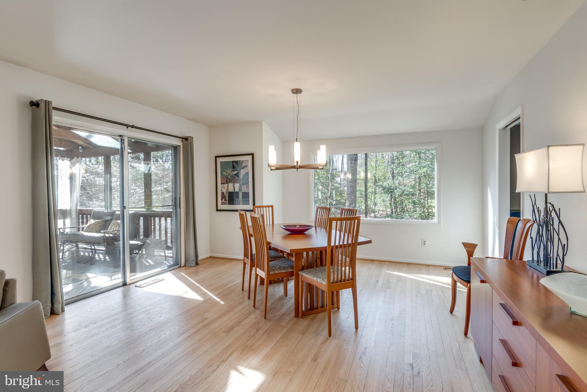 11401 Drop Forge Lane Reston, VA 20191 - Photo 9 of 38 a view of a dining room with furniture window and wooden floor