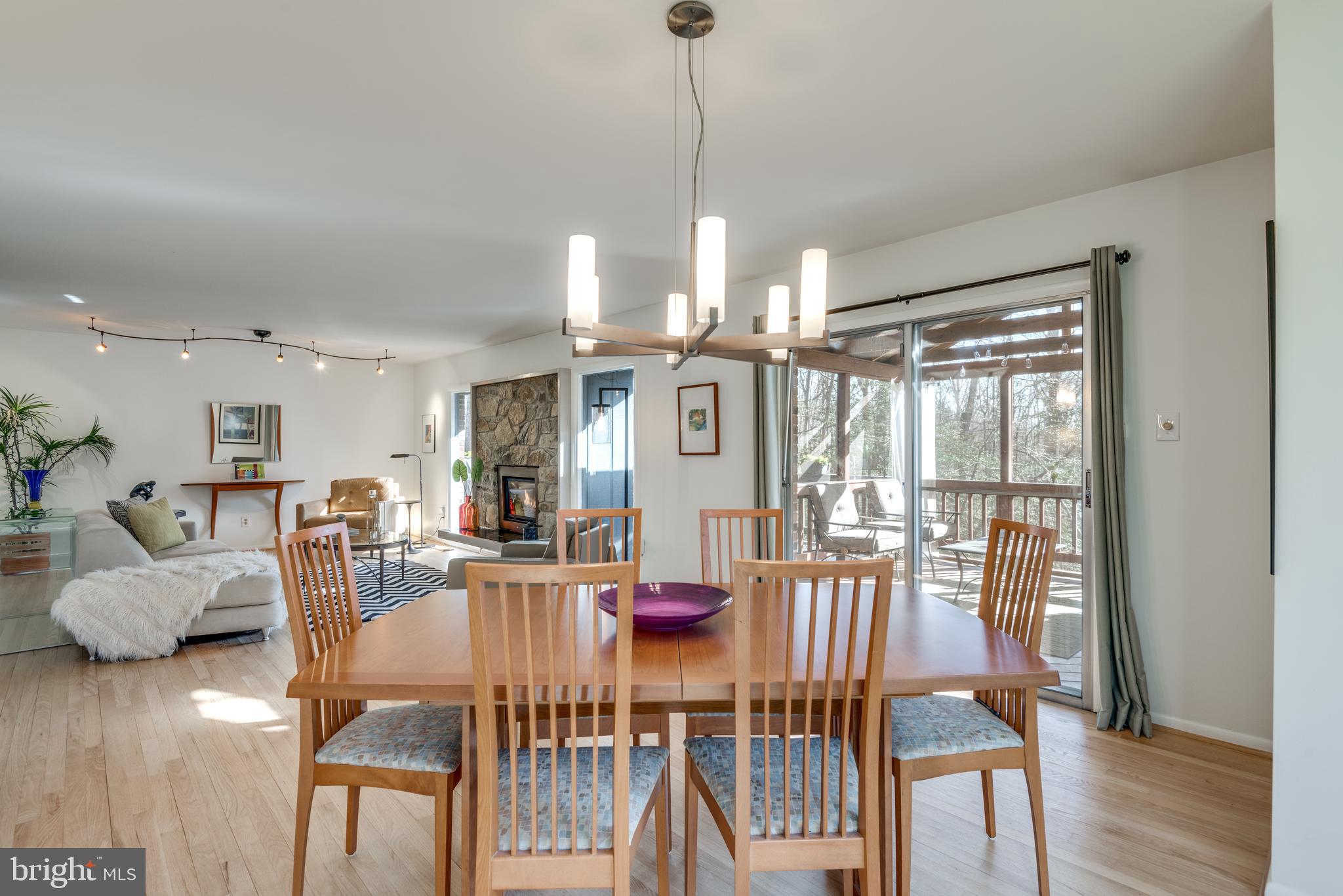11401 Drop Forge Lane Reston, VA 20191 - Photo 10 of 38 a view of a dining room with furniture window and wooden floor