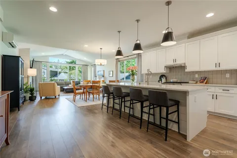 a view of hall way with furniture and entryway