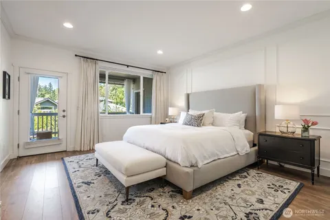 a bedroom with a bed and a night stand