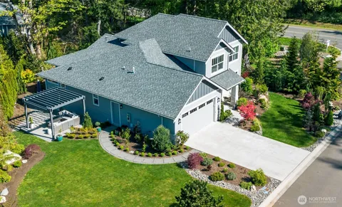 a aerial view of a house with table and chairs potted plants