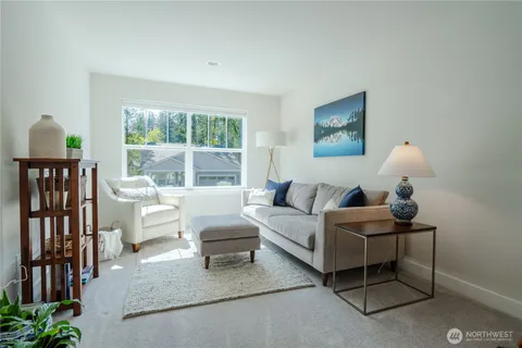 a spacious bedroom with a bed and a window