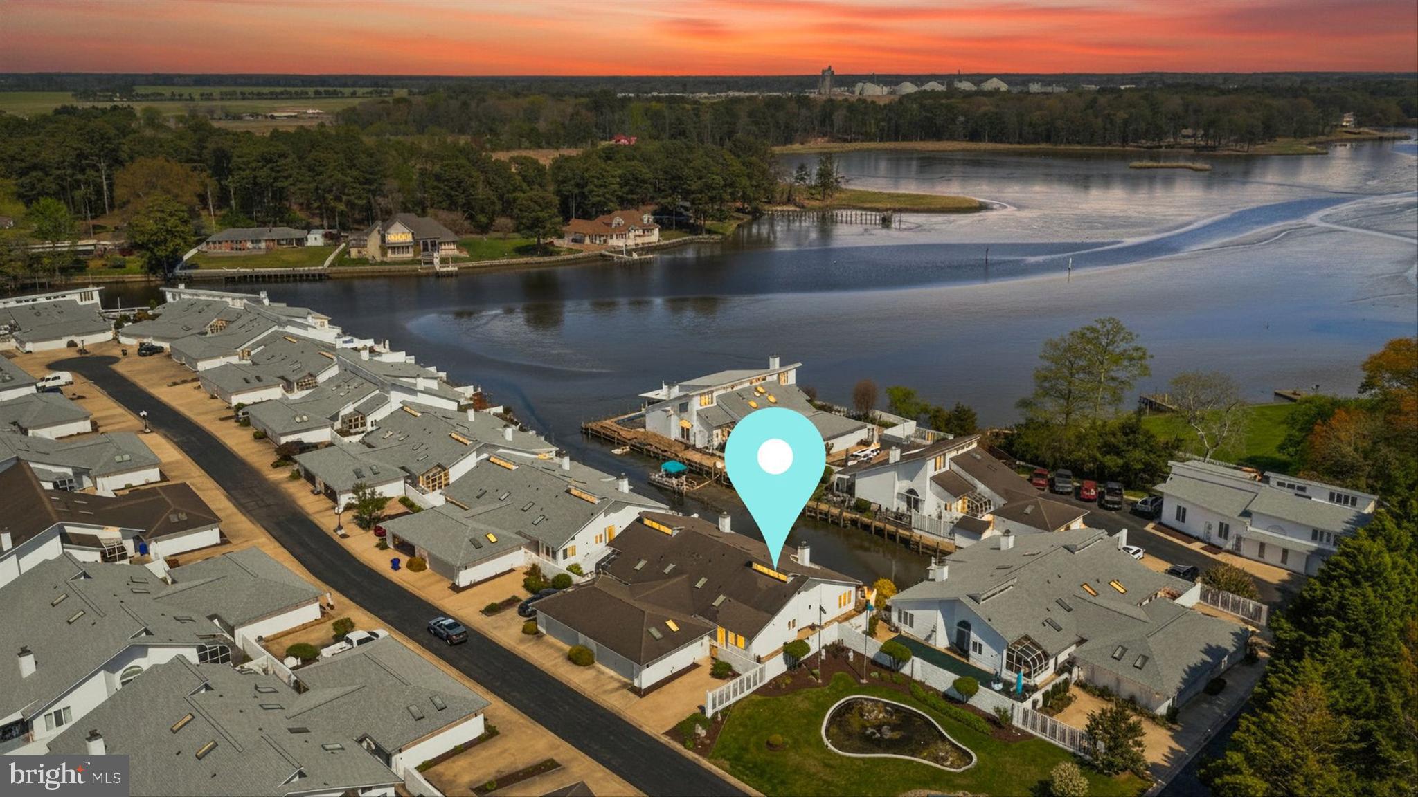 an aerial view of a house with a lake view