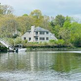a house with river in front of it