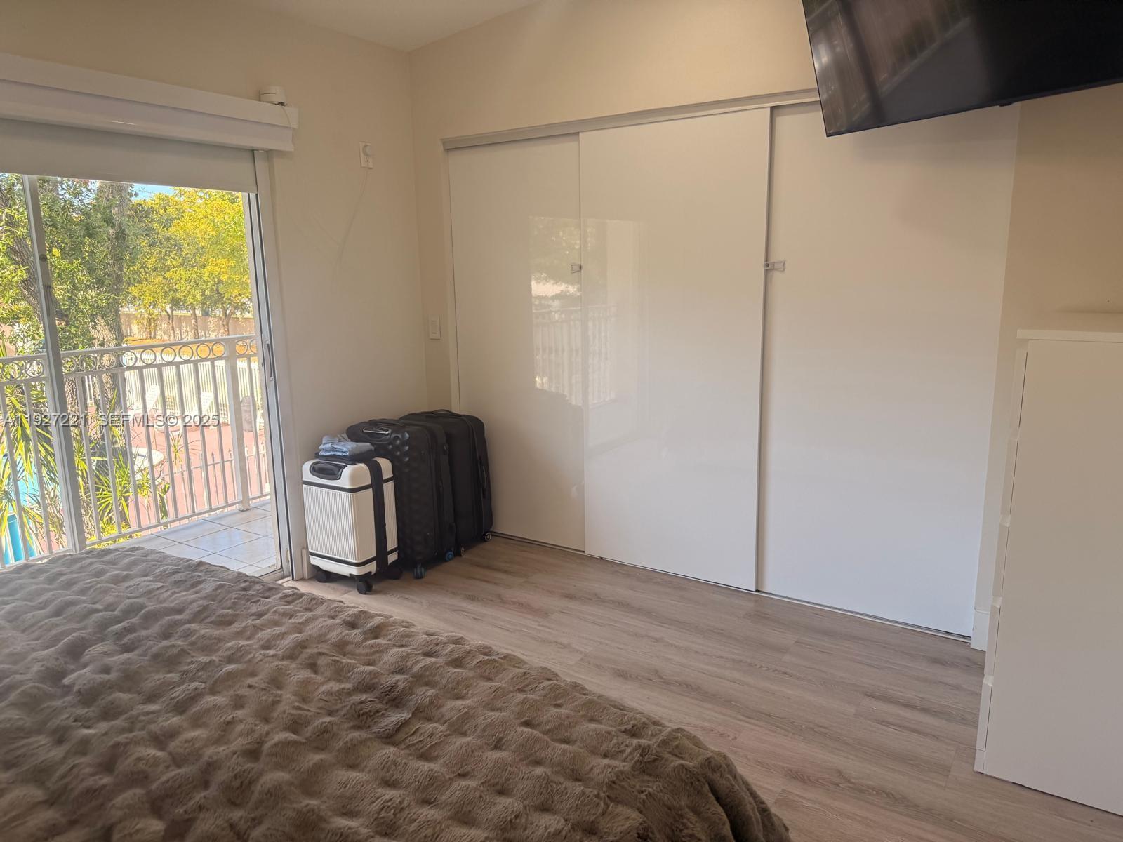 6864 Northwest 166th Terrace, Unit 903 Miami Lakes, FL 33014 - Photo 21 of 29 a view of an empty room with a window