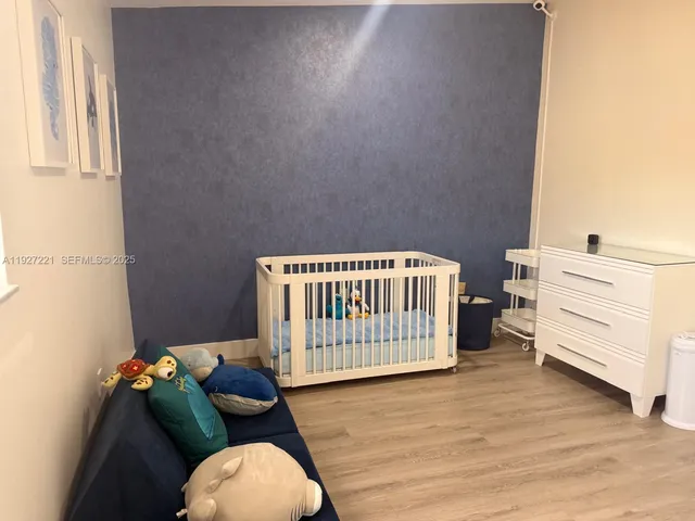 a bedroom with a bed and chair