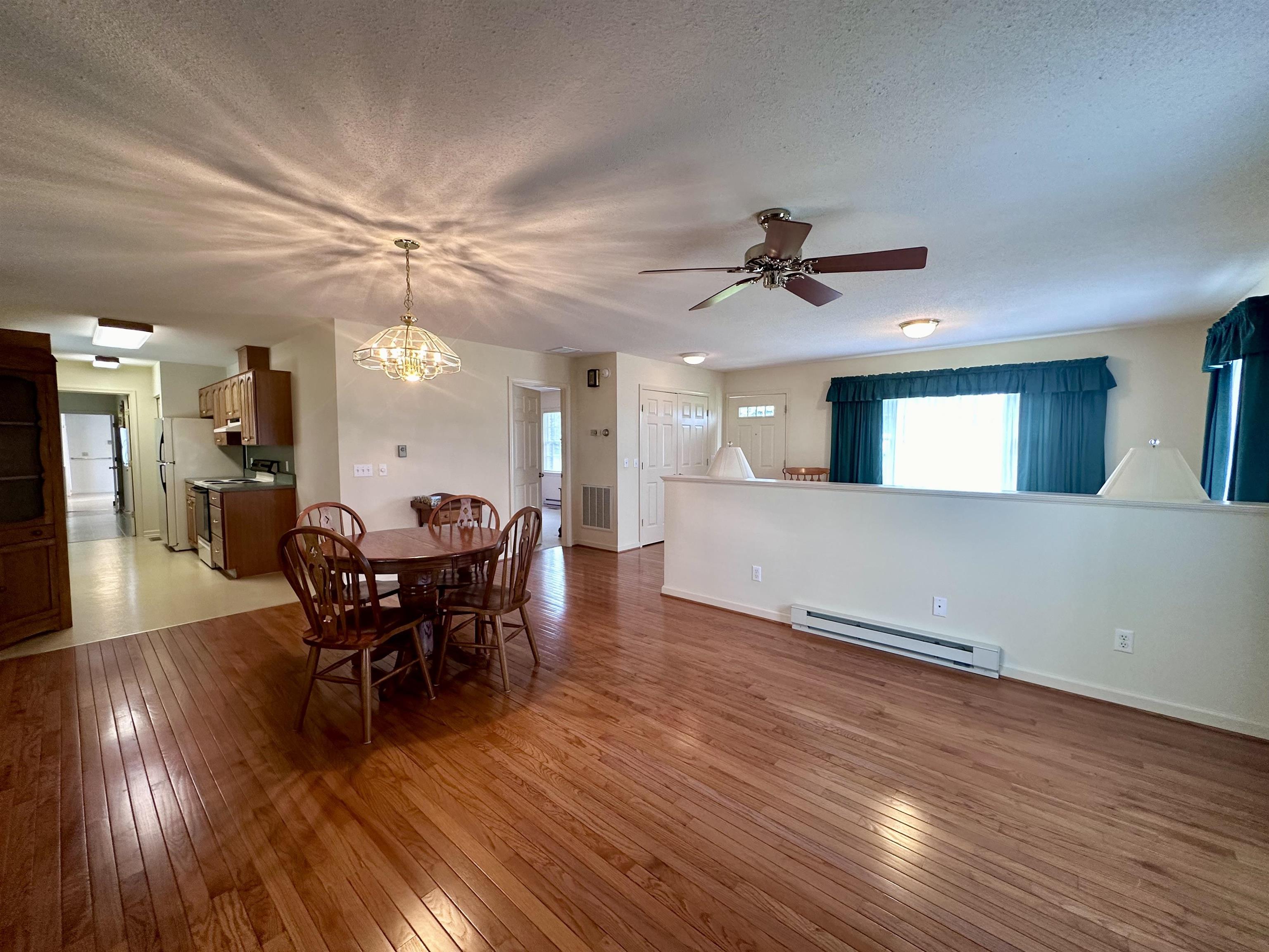 364 Summit Church Road Bridgewater, VA 22812 - Photo 11 of 32 a view of a dining room with furniture and wooden floor
