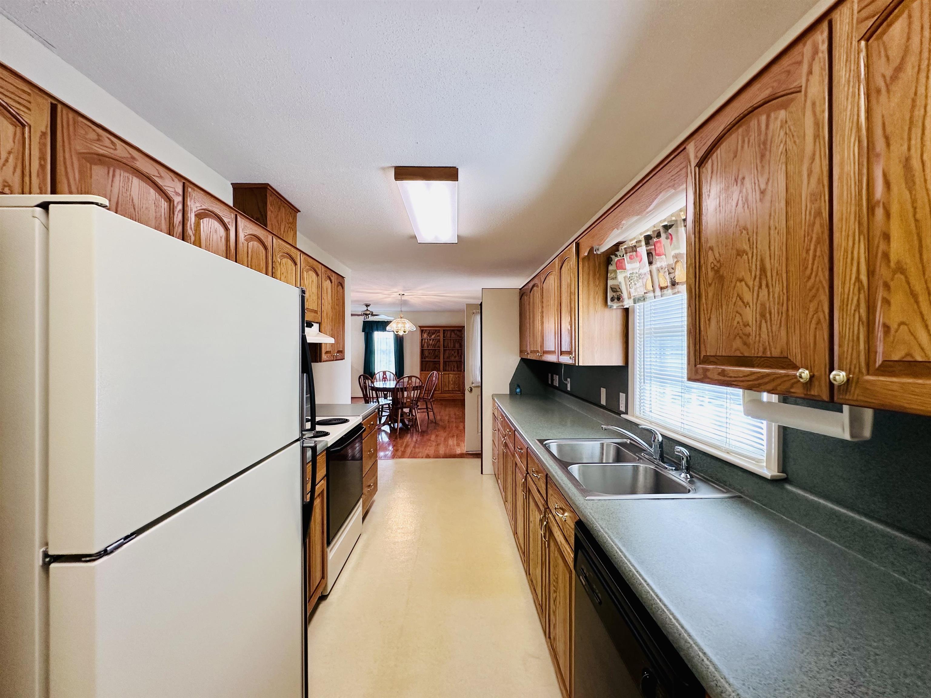 364 Summit Church Road Bridgewater, VA 22812 - Photo 12 of 32 a kitchen with stainless steel appliances granite countertop a sink a stove and a refrigerator