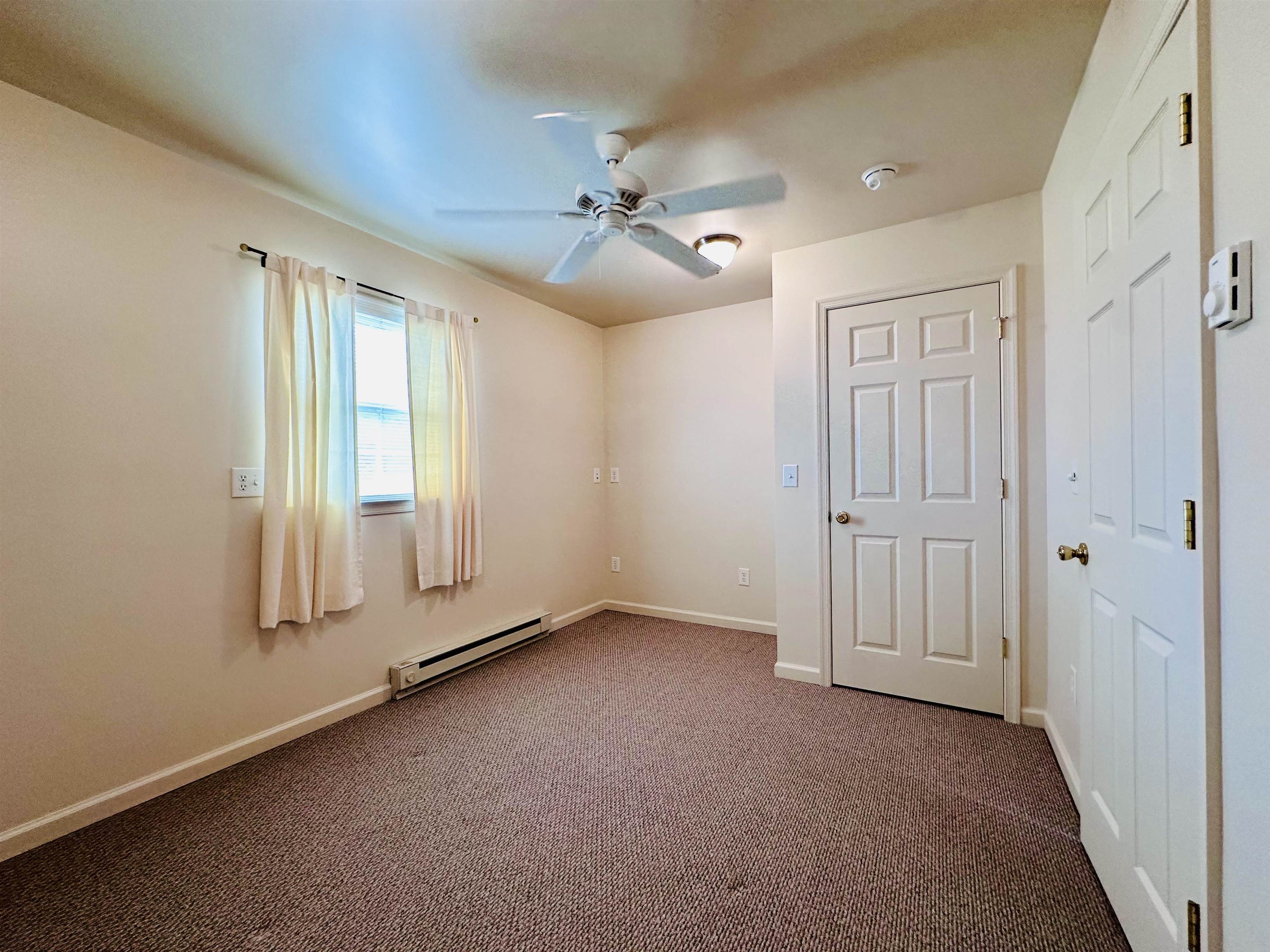 364 Summit Church Road Bridgewater, VA 22812 - Photo 19 of 32 an empty room with windows and fan