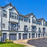 a front view of residential houses with yard