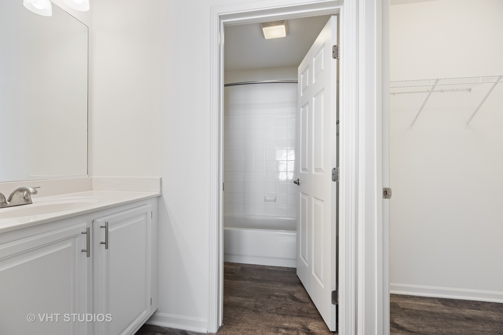 84 Gershwin Court, Unit 84 Wheaton, IL 60189 - Photo 13 of 60 a bathroom with a sink and mirror