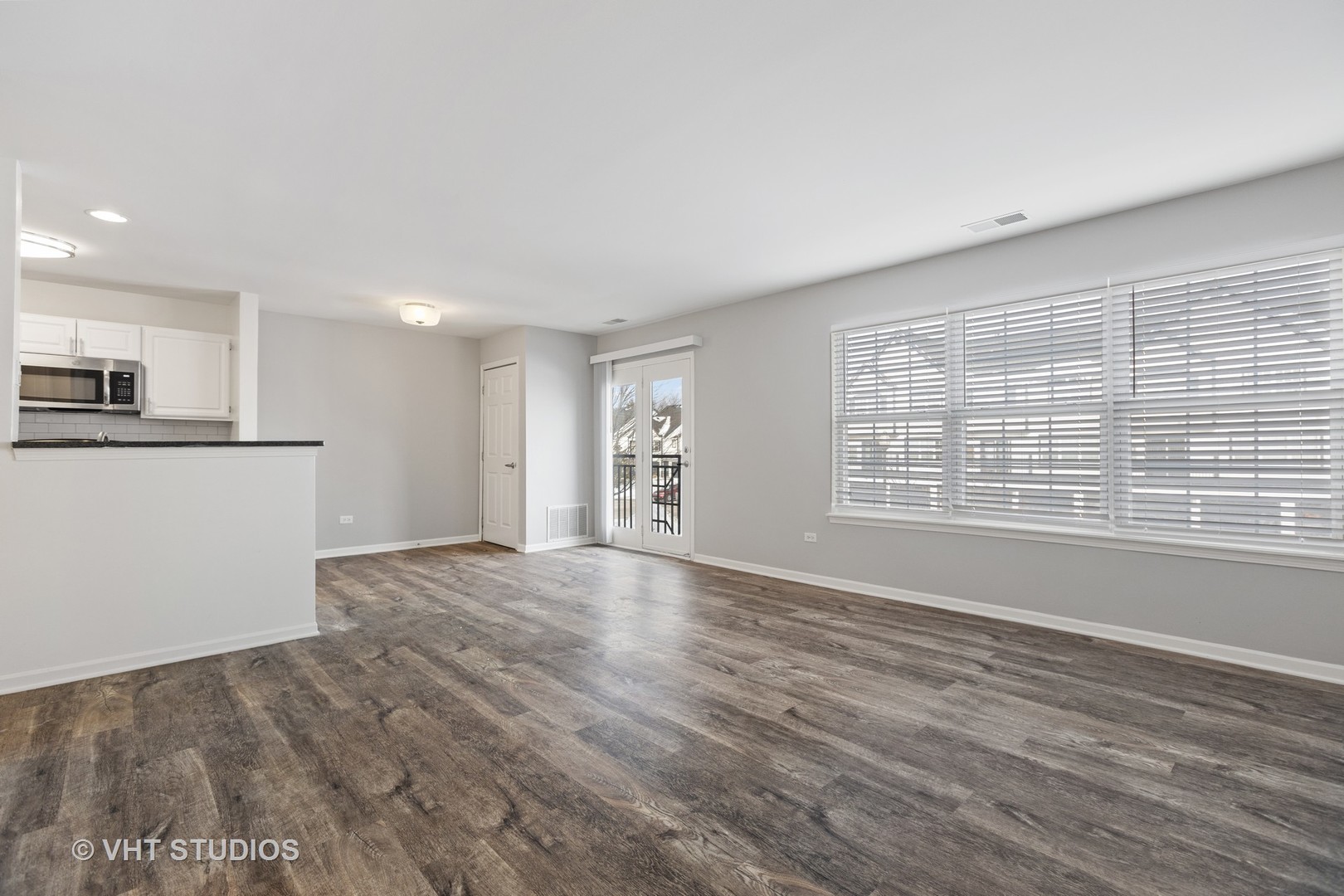 84 Gershwin Court, Unit 84 Wheaton, IL 60189 - Photo 2 of 60 a view of an empty room with a window