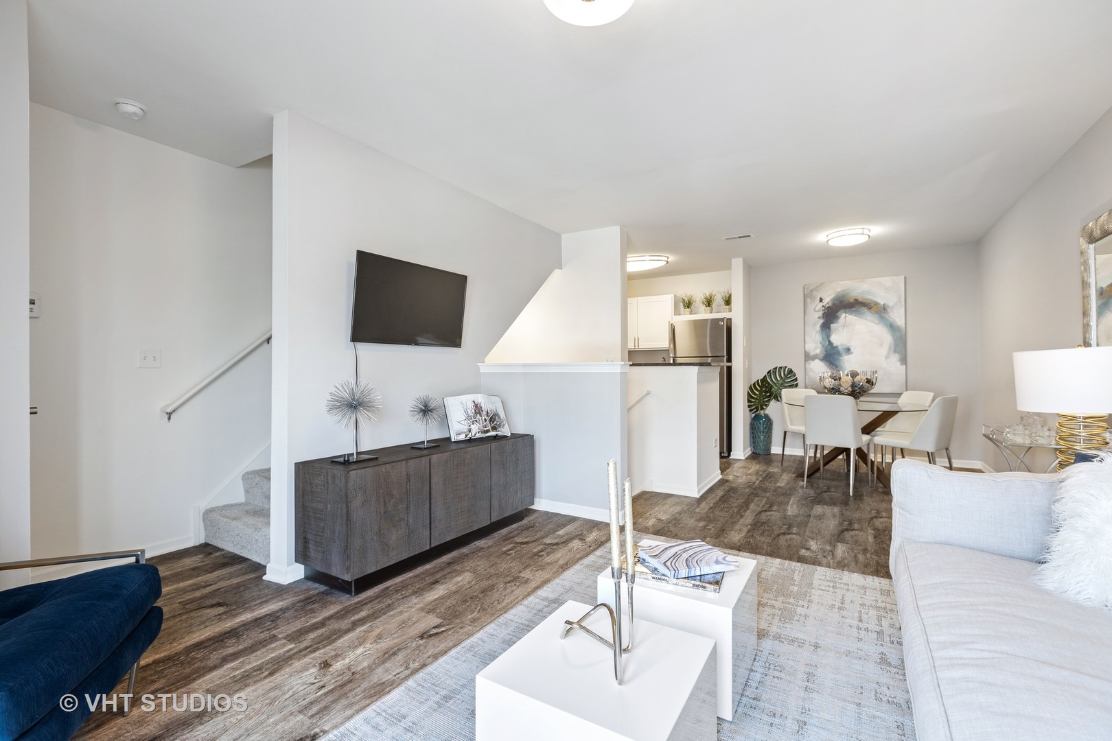 84 Gershwin Court, Unit 84 Wheaton, IL 60189 - Photo 37 of 60 a living room with furniture and a flat screen tv