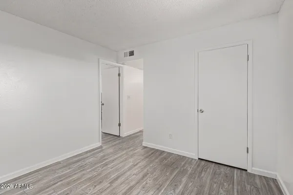 a view of room with hardwood floor