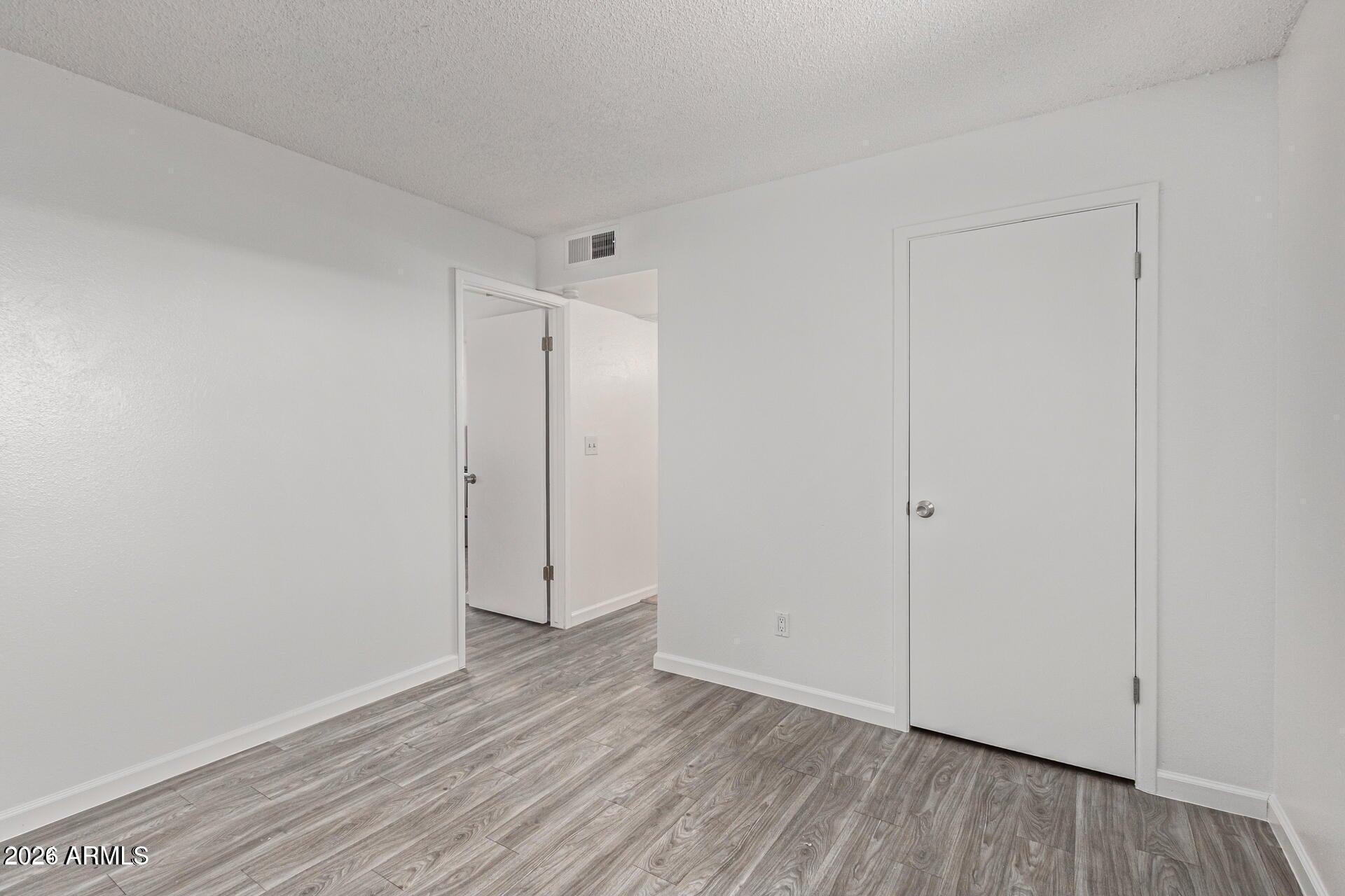 1029 South Wilson Street, Unit 14 Tempe, AZ 85281 - Photo 8 of 12 a view of room with hardwood floor