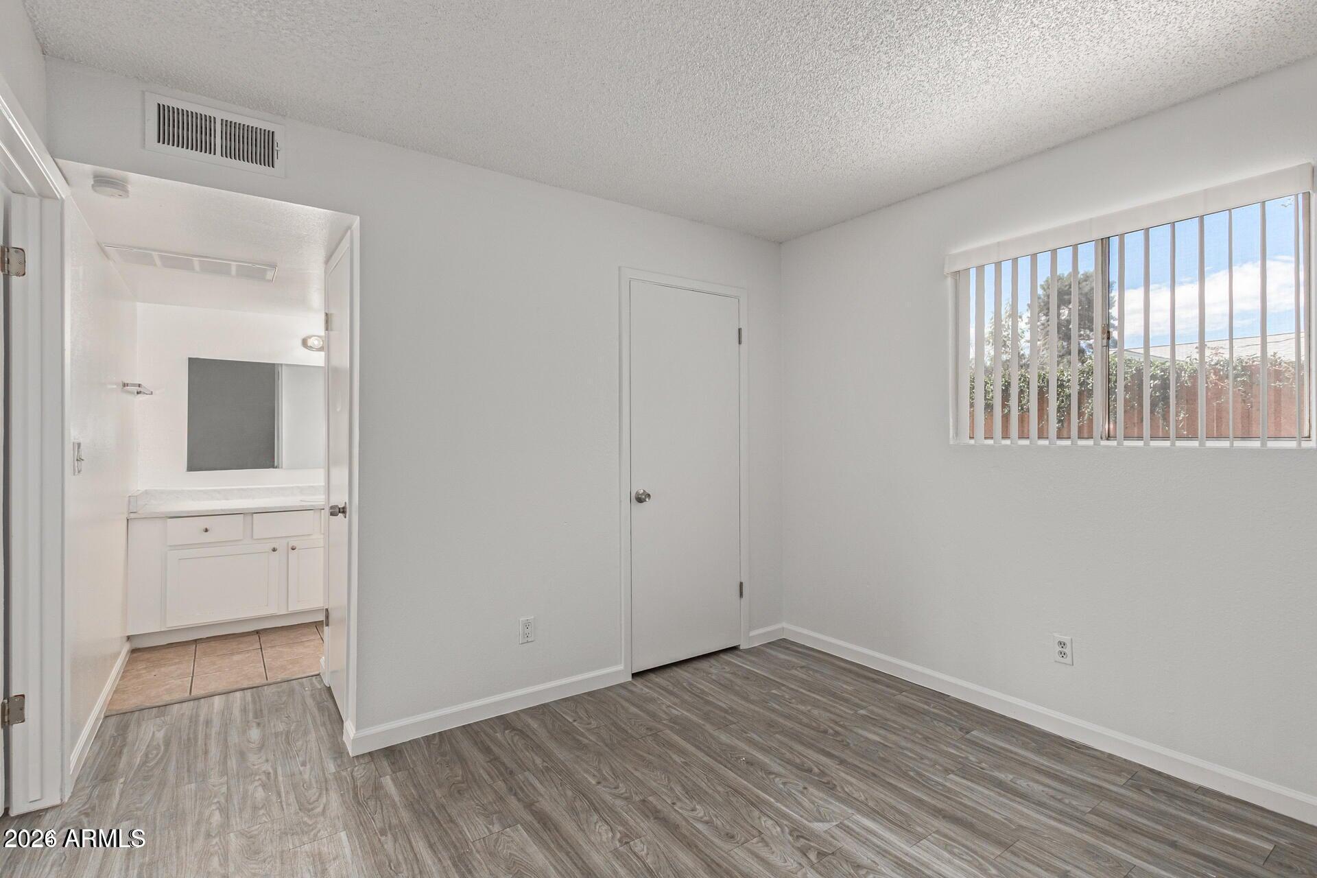 1029 South Wilson Street, Unit 14 Tempe, AZ 85281 - Photo 10 of 12 wooden floor in an empty room