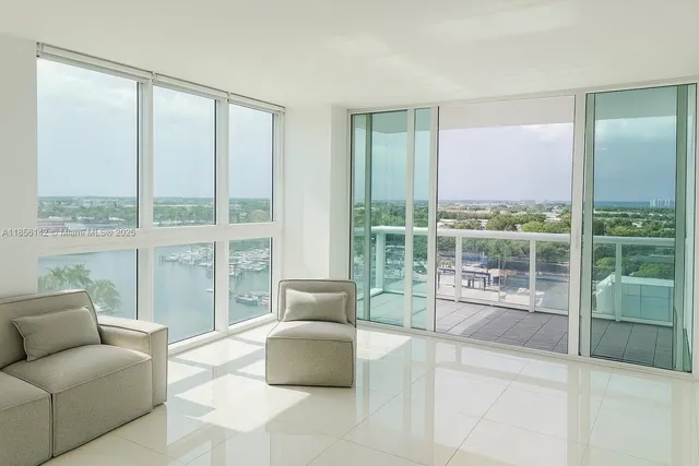 a living room with furniture and windows