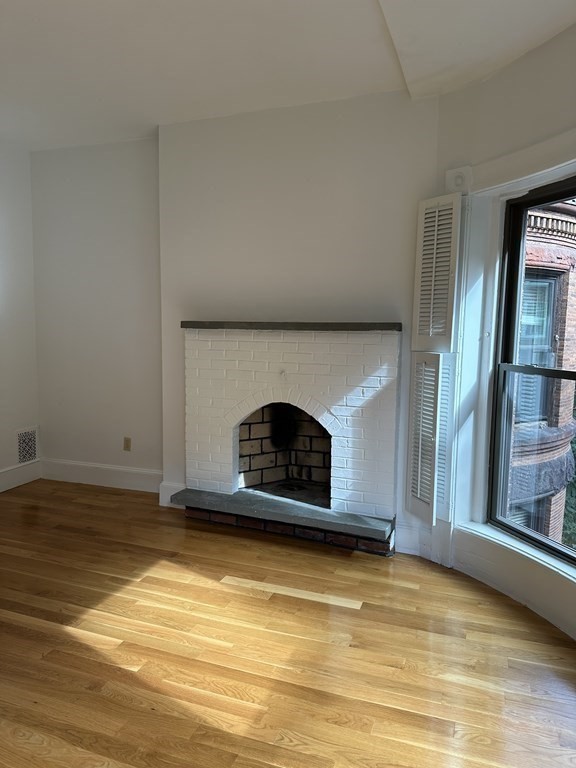 29 Bay State Road, Unit 3 Boston, MA 02215 - Photo 12 of 22 a view of empty room with a fireplace