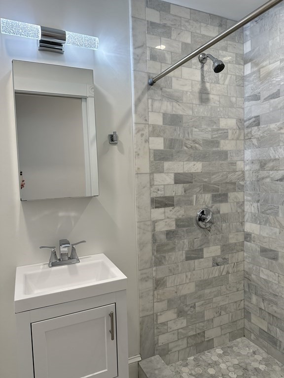 29 Bay State Road, Unit 3 Boston, MA 02215 - Photo 15 of 22 a bathroom with a sink and a mirror