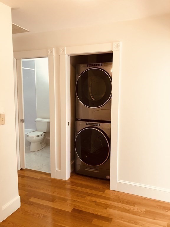 29 Bay State Road, Unit 3 Boston, MA 02215 - Photo 18 of 22 a view of a hallway with washer and dryer