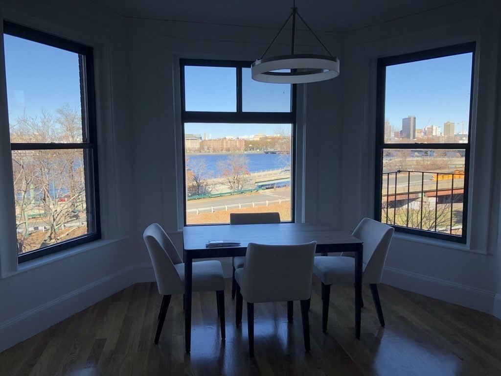 29 Bay State Road, Unit 3 Boston, MA 02215 - Photo 3 of 22 a view of a dining room with furniture window and wooden floor