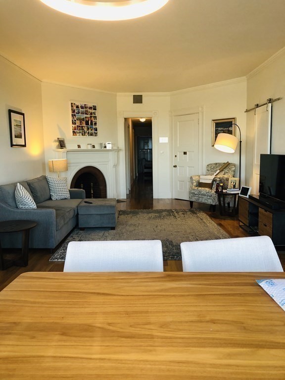 29 Bay State Road, Unit 3 Boston, MA 02215 - Photo 5 of 22 a living room with furniture and a fireplace