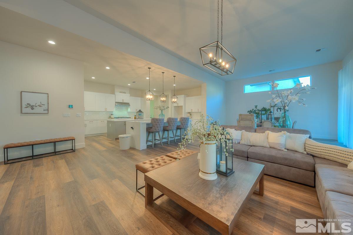 3018 Copper Stone Drive Reno, NV 89521 - Photo 17 of 29 a living room with furniture and a dining table