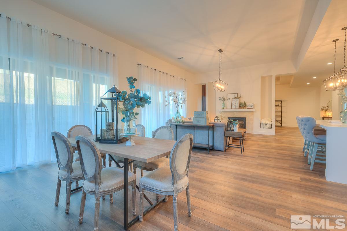3018 Copper Stone Drive Reno, NV 89521 - Photo 18 of 29 a view of a dining room with furniture and wooden floor